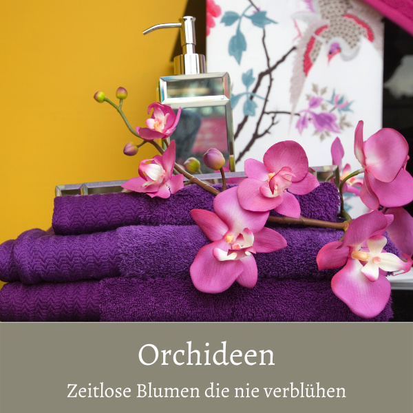 künstliche Orchideen Rispe rosa auf Handtuch zur Deko gelegt